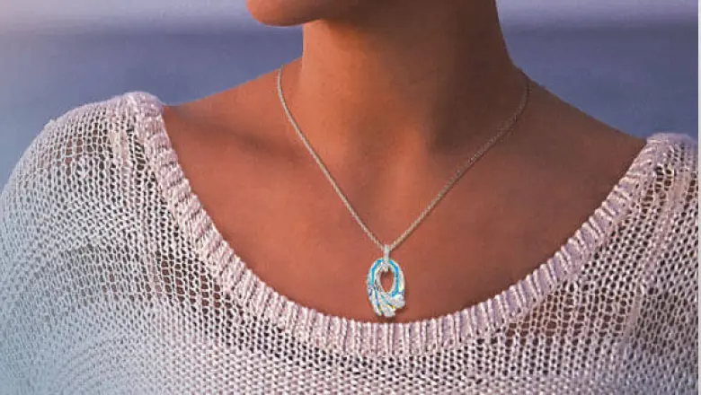 Woman wearing the Shimmering Sea Crystal Pendant